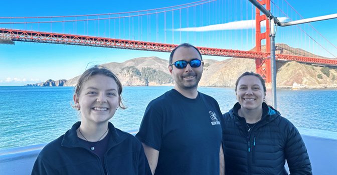 Ocean Discovery League (ODL) Team onboard NOAA Ship Okeanos Explorer. Left to right: Ami Vice; Brian Kennedy, ODL Chief Scientist; Katie Leeper, ODL Community Engagement Manager. Credit: Kasey Cantwell, NOAA Ocean Exploration (OER).